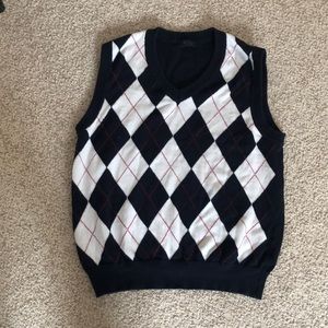 A v-neck sweater that is red, navy blue, and white